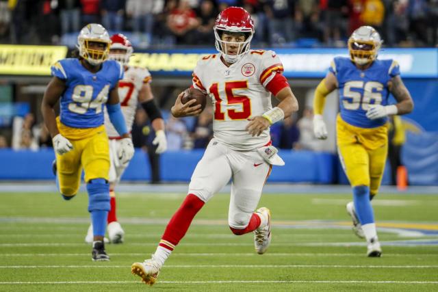 Los Angeles Rams quarterback Bryce Perkins runs the ball during the first  half of an NFL football game against the Kansas City Chiefs Sunday, Nov.  27, 2022, in Kansas City, Mo. (AP