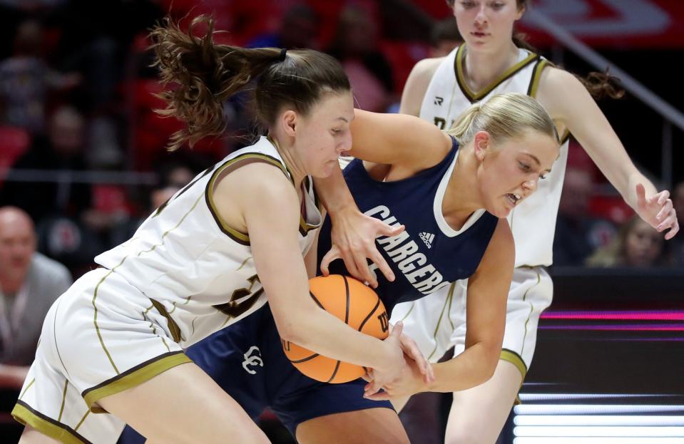 Davis High School’s Avery Dain and Corner Canyon’s Brooke Luper fight for the ball during a 6A girls quarterfinal basketball game at the Huntsman Center in Salt Lake City on Monday, Feb. 26, 2024. Corner Canyon won 59-56 in overtime. | Kristin Murphy, Deseret News