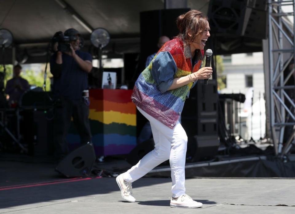 <p>While speaking at the event Harris wore white skinny jeans, and trainers to put the rainbow jacket on centre stage.</p>