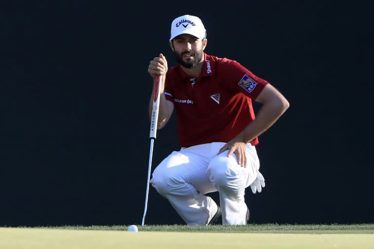 Canada's Adam Hadwin putts on the 16th green during the third round of the Valspar Championship on March 11, 2017 in Palm Harbor, Florida