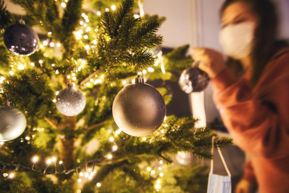 If you can’t go outside to clean your tree, wear a high quality mask over your nose and mouth, as well as gloves, to reduce allergies.