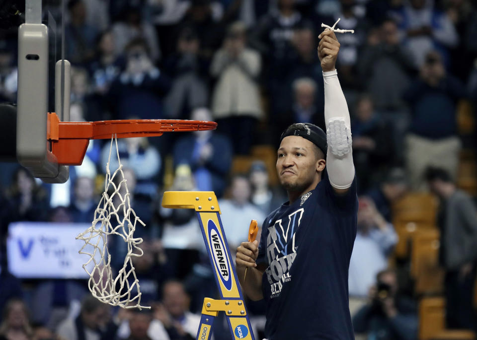 Villanova’s Jalen Brunson celebrates after cutting a piece of net following the team’s win over Texas Tech in an NCAA men’s college basketball tournament regional final, Sunday, March 25, 2018, in Boston. Villanova won 71-59 to advance to the Final Four. (AP Photo/Charles Krupa)