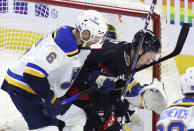 St. Louis Blues' Marco Scandella (6) hits Ottawa Senators' Parker Kelly (27) with his stick during the second period of an NHL hockey game Thursday, March 21, 2024, in Ottawa, Ontario. Scandella was penalized for high-sticking. (Patrick Doyle/The Canadian Press via AP)