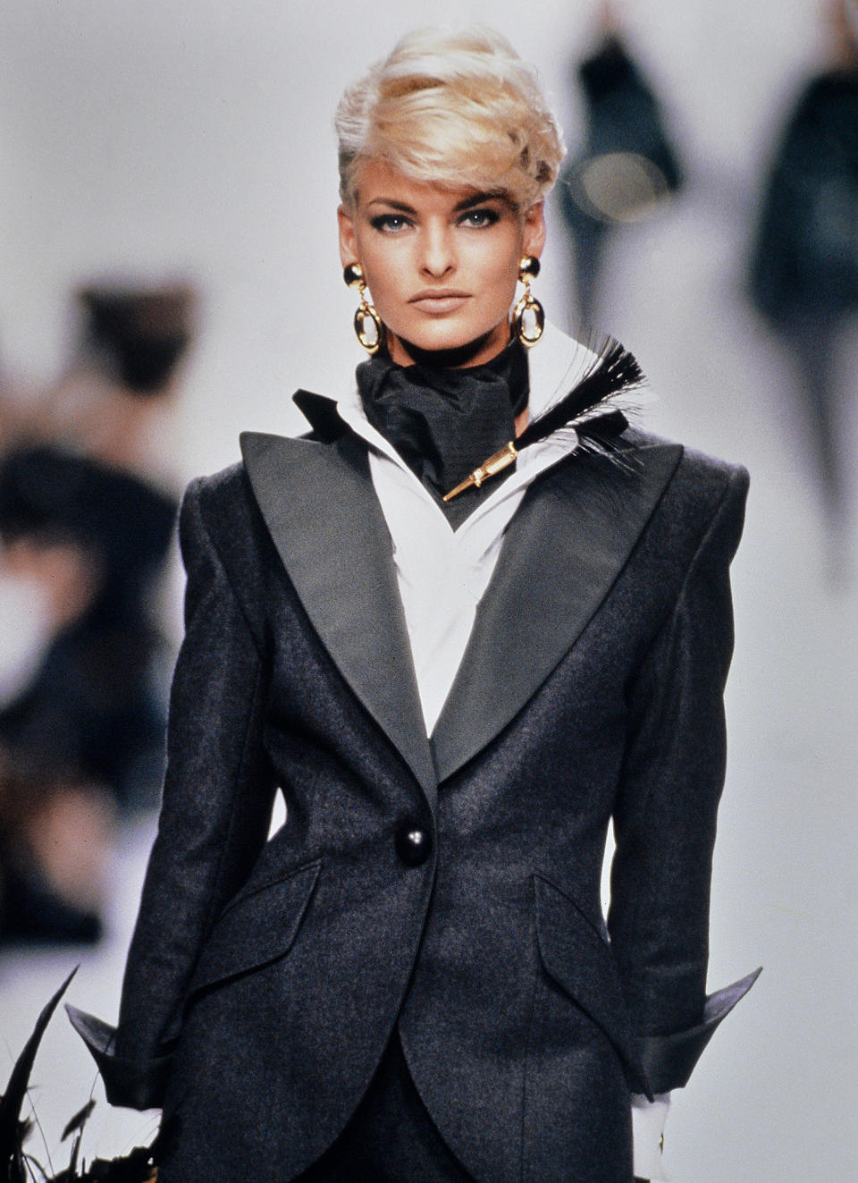 <p>Evangelista and her platinum pixie command the catwalk during the Dior show at Paris Fashion Week in 1991. </p>