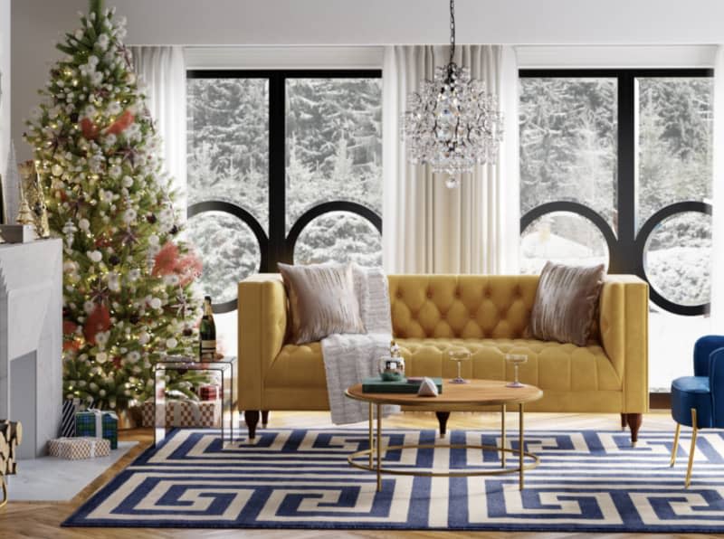 living room with Christmas tree and yellow sofa and holiday decor