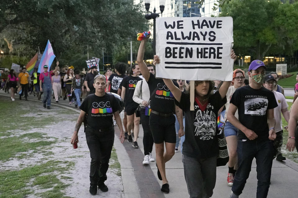 FILE - Hundreds of people, including immigrants rights groups, abortion rights groups and members of the LGBTQ community from across the state take part in a rally and march, Monday, May 1, 2023, in Orlando, Fla. The rights of LGBTQ+ people continue to be in flux across the U.S. with a new flurry of developments. (AP Photo/John Raoux, File)
