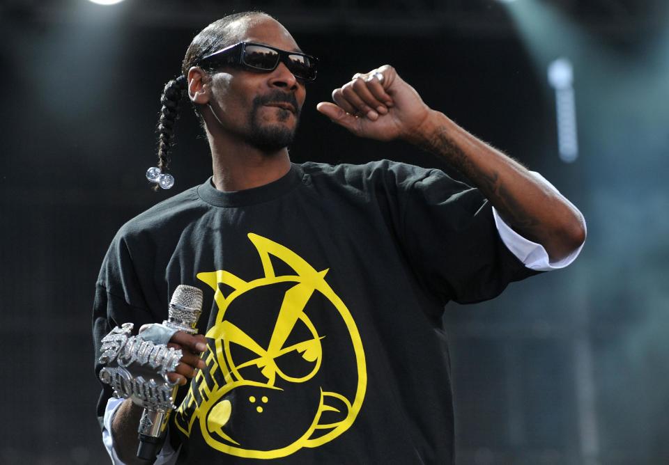 FILE - In a July 7, 2011 file photo US hip-hop artist Snoop Dogg performs on stage at the Balaton Sound festival in Zamardi, Hungary. “People are learning how to live and get along more, and accept people for who they are and not bash them or hurt them because they're different,” Snoop said in a recent interview. (AP Photo/MTI, Tamas Kovacs, File)