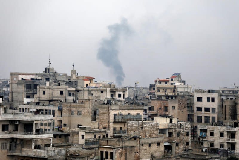 Smoke rises during government forces bombing on the village of Sarmin, near Idlib, Syria, in 2020. File Photo by Yahya Nemah/EPA-EFE