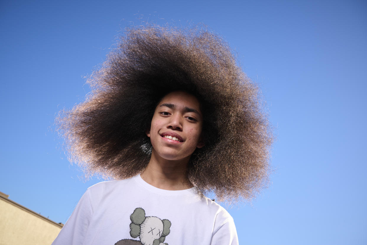 At 14 years old, Amir Menedez, has achieved the Guinness World Record for the largest afro — both in the 