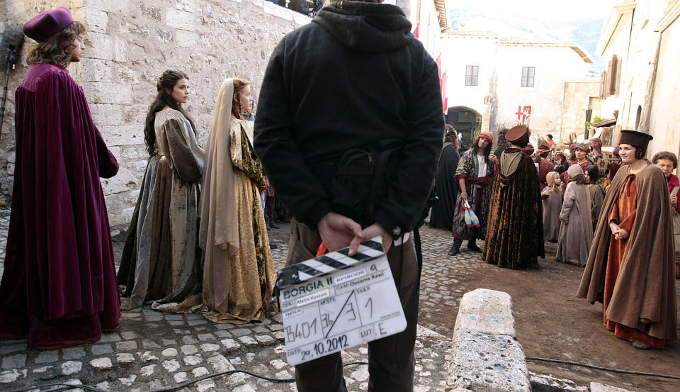 In this photo taken Monday, Oct. 29, 2012, actors prepare for the start of the shooting of "Borgia" tv series in Sermoneta, Italy. The Italian economy may be struggling but the pan-European television series “Borgia,” which is now filming its second season in Italy, is a thriving hit on the world market. Spanning the late Middle Ages to the early Renaissance period, the show follows the famous Borgia family's rise to power and subsequent domination of the Vatican and southern Europe's political landscape. A winning combination of sex, violence, faith, lust and betrayal, the primarily French-German production has been sold in 85 countries worldwide.(AP Photo/Gregorio Borgia)