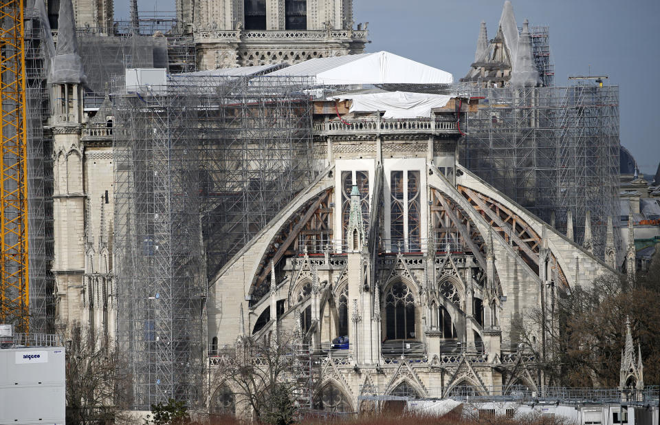 PARIS, FRANCE - FEBRUARY 15: Notre-Dame de Paris Cathedral is seen almost three years after fire ravaged the emblematic monument on February 15, 2021 in Paris, France. On April 15, 2019, a fire broke out in the heart of Notre-Dame de Paris. For about 15 hours, firefighters fought against the flames that ravaged this historic monument in the French capital. Almost three years later, the last stages of securing continue. The great void is thus filled by metal scaffolding, which surrounds the entire site, serving in particular to consolidate the vaults with the assistance of wooden hangers. These same steel tubes will also be used, in the future, to clean up the walls contaminated by the lead emitted during the fire. The securing of the building, between the stabilization of the structure, the replacement of stones and the solidification of the vaults, will have cost 165 million euros. The origin of the flames remains, for the moment, still unknown. (Photo by Chesnot/Getty Images)