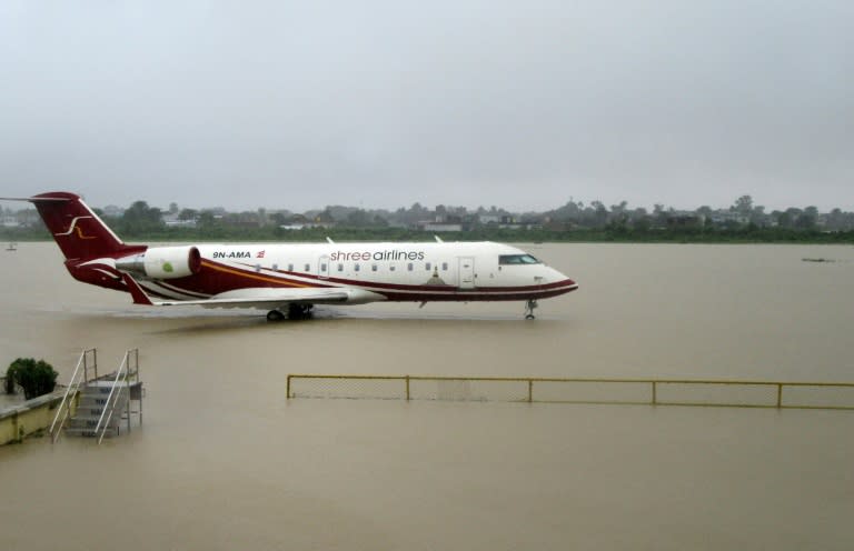 An aircraft is seen parked the flooded domestic airport in Biratnagar, Nepal after heavy rains