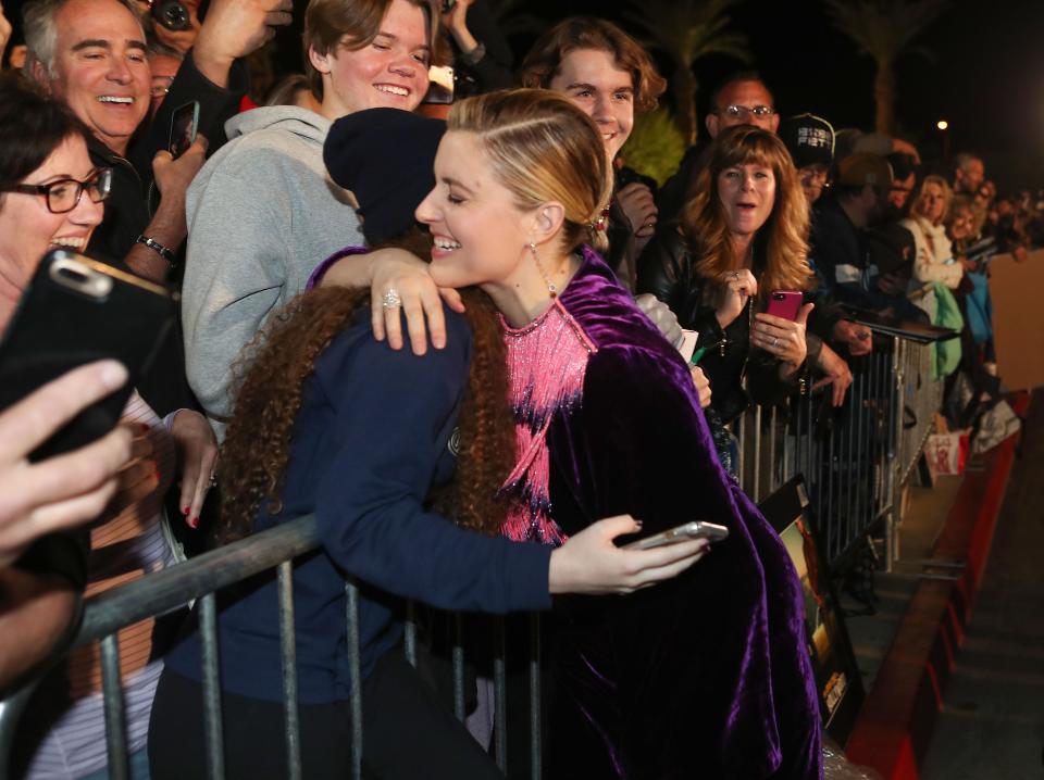 Greta Gerwig has a moment with fan Malia Reed while signing autographs for fans at the Palm Springs International Film Festival Awards Gala at the Palm Springs Convention Center, January 2, 2020.