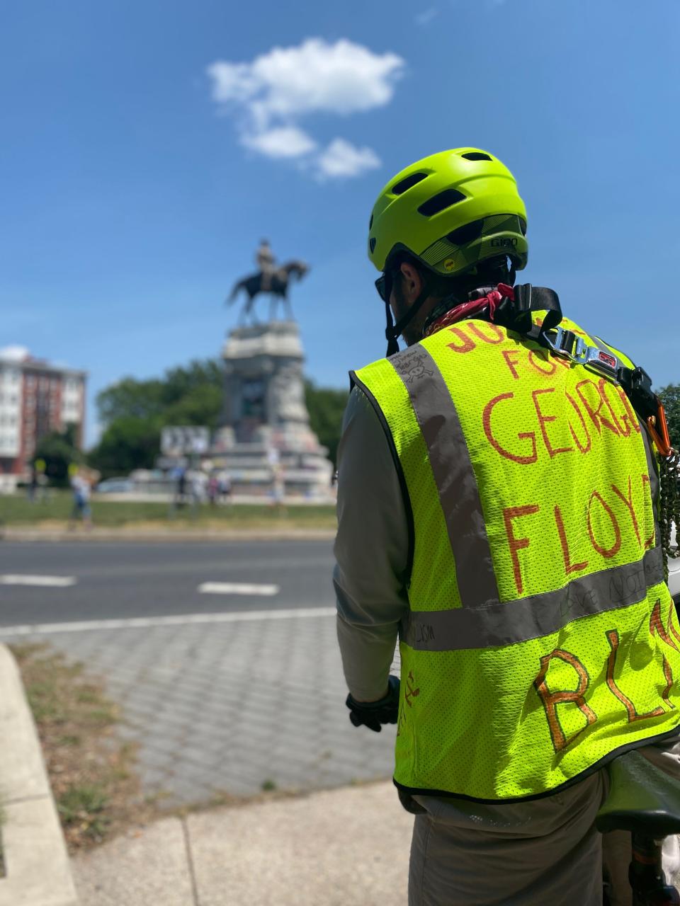 James Kelley, 29, of Richmond, Virginia, attends a protest at the Robert E. Lee statue wearing a vest marked with the words “Justice for George Floyd”