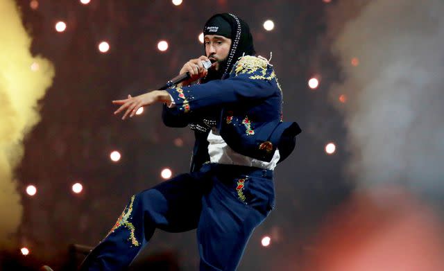 <p>Gladys Vega/Getty </p> Bad Bunny performing in 2024