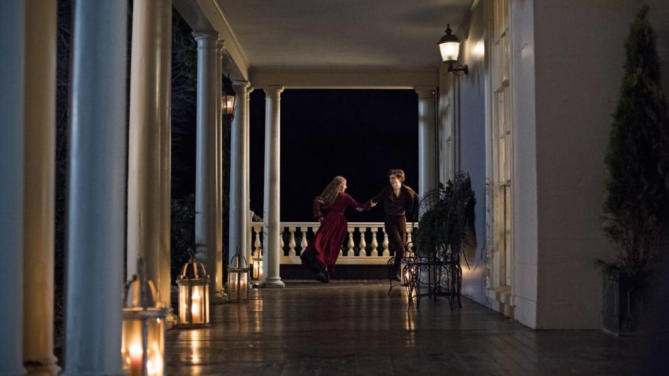 Saoirse Ronan and Timothée Chalamet dancing on a veranda in "Little Women."