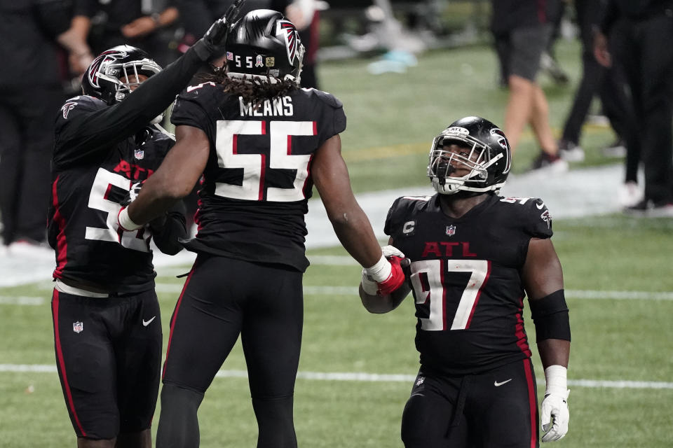 Atlanta Falcons defensive end Steven Means (55) celbrates hitting Las Vegas Raiders quarterback Derek Carr (4) causing a fumble during the second half of an NFL football game, Sunday, Nov. 29, 2020, in Atlanta. The Atlanta Falcons won 43-6. (AP Photo/John Bazemore)