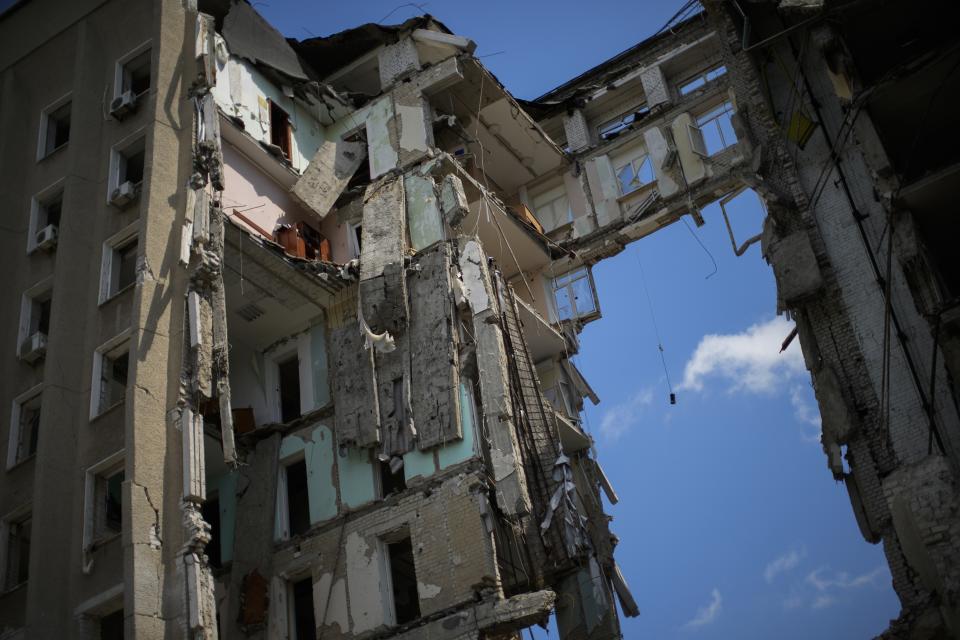 FILE - Pieces of debris hang at the regional government headquarters of Mykolaiv, which was heavily damaged in a Russian attack, in Mykolaiv, Ukraine, May 14, 2022. In a deliberate, widespread campaign, Russian forces systematically targeted influential Ukrainians, nationally and locally, to neutralize resistance through detention, torture and executions, an Associated Press investigation has found. (AP Photo/Francisco Seco, File)