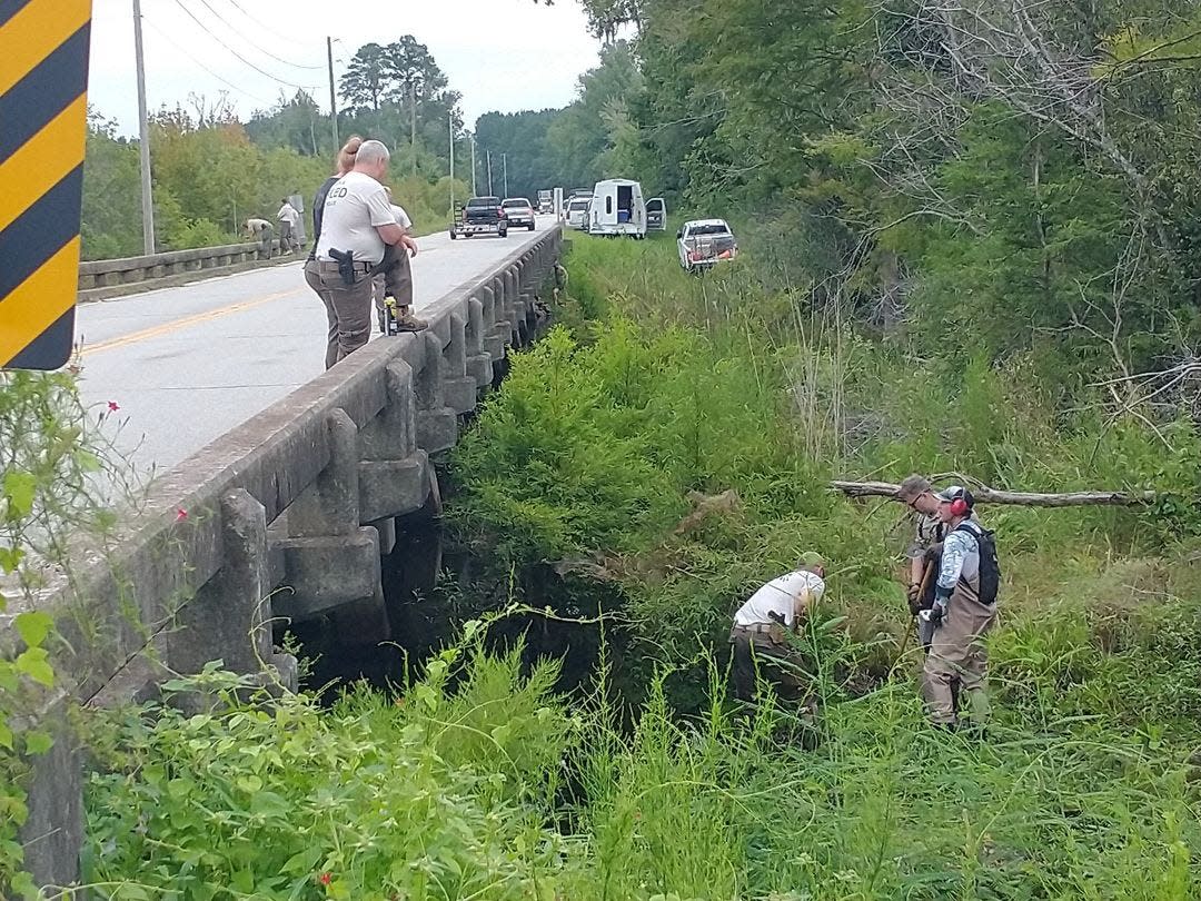 SLED teams search a river in Hampton County last week.