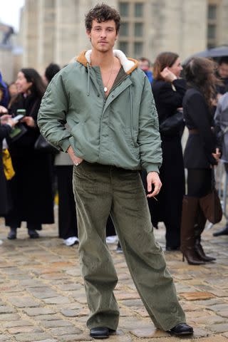 <p>Jacopo Raule/Getty</p> Shawn Mendes outside of the Loewe fall/winter 2024 Paris Fashion Week show