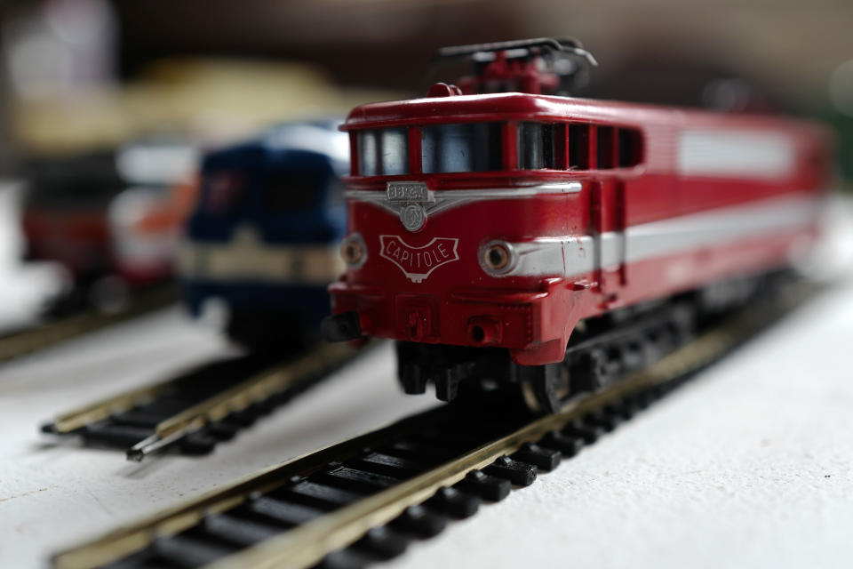 Model trains on train tracks, belonging to Guy Warein, a 70-year-old retiree, on display at his home in Richebourg, northern France, Wednesday, Jan. 27, 2021. The old-school pastimes of making scale models and playing with miniature trains are making a comeback as a form of therapy against the pandemic blues. Sales are booming as locked-down families glue and paint models and dust off train sets. (AP Photo/Michel Spingler)