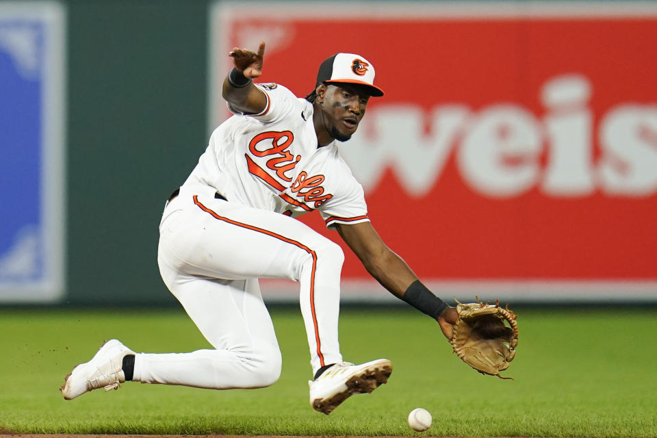 Baltimore Orioles shortstop Jorge Mateo digs out a groundout by Chicago White Sox's Eloy Jimenez during the sixth inning of a baseball game, Thursday, Aug. 25, 2022, in Baltimore. (AP Photo/Julio Cortez)