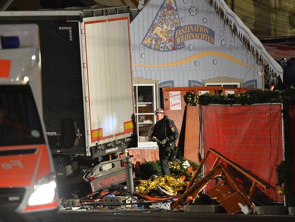 <p>Policemen investigate the truck that sped into a Christmas market in Berlin. Photo: ODD ANDERSEN/AFP/Getty Images</p>