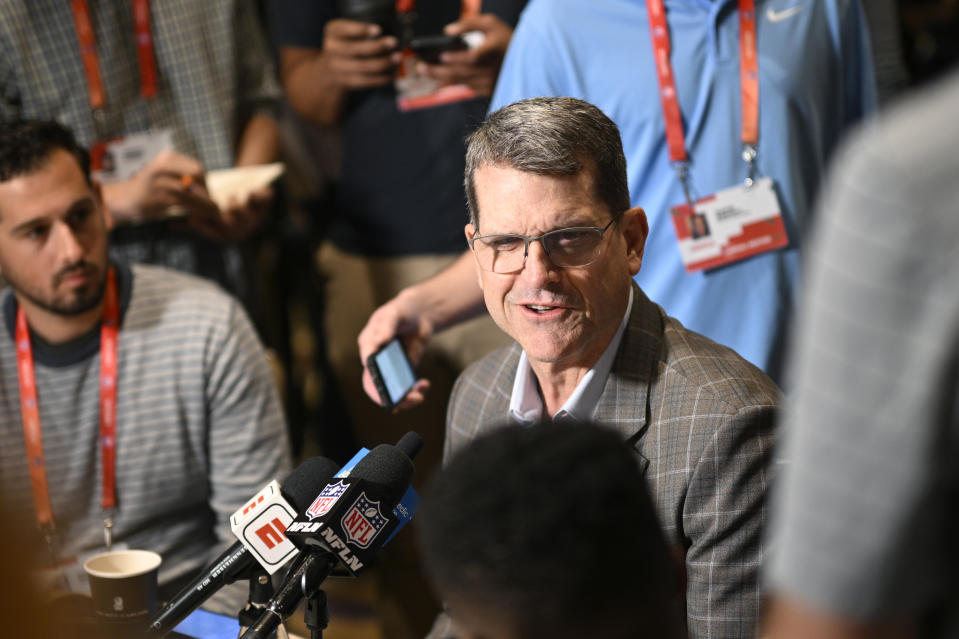 Los Angeles Chargers head coach Jim Harbaugh talks with reporters during an AFC coaches availability at the NFL owners meetings, Monday, March 25, 2024, in Orlando, Fla. (AP Photo/Phelan M. Ebenhack)