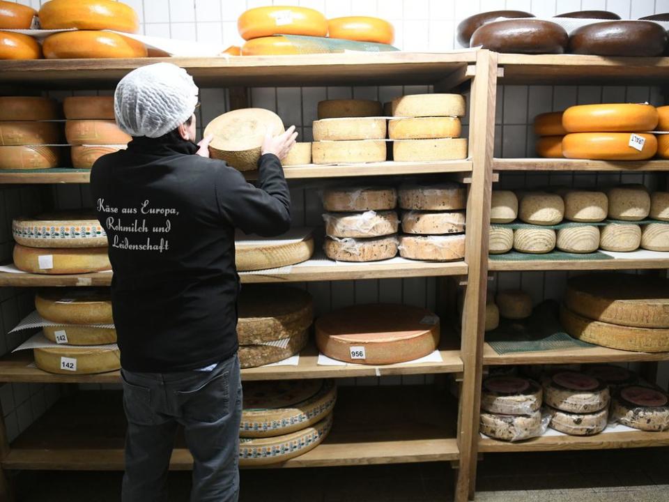 Tölzer Kasladen managing director Wolfgang Hofmann stands in one of the cheese warehouses. | picture alliance/Getty Images