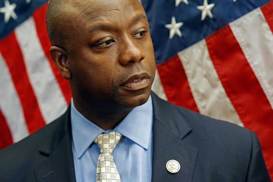 Tim Scott in 2011 with an American flag in the background