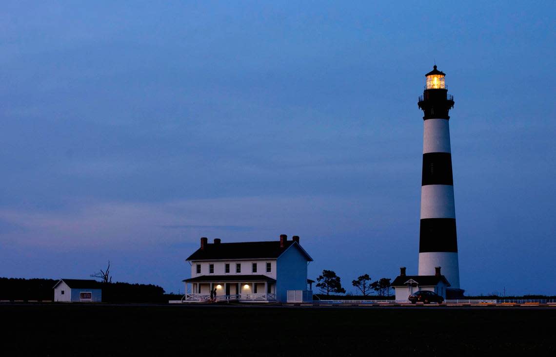 The Bodie Island Lighthouse is illuminated as dusk falls on at the Cape Hatteras National Seashore on the outer banks of North Carolina in 2015.