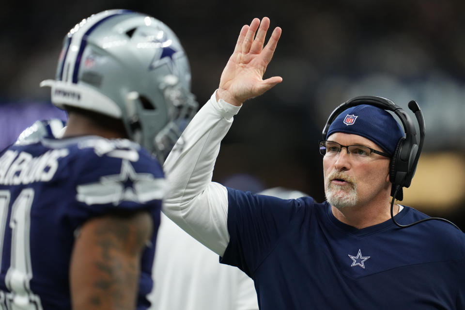 Dallas Cowboys defensive coordinator Dan Quinn (right) and linebacker Micah Parsons (left) will pull out all the stops to try to contain the potent 49ers offense in Sunday's divisional playoff game. (Photo by Cooper Neill/Getty Images)