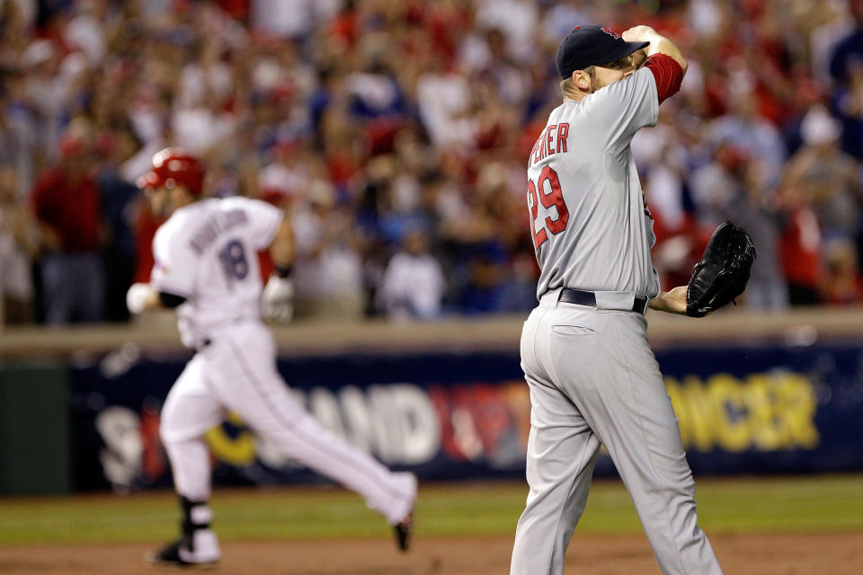 ARLINGTON, TX - OCTOBER 24: Chris Carpenter #29 of the St. Louis Cardinals reacts after giving up a solo home run to Mitch Moreland #18 of the Texas Rangers in the third inning during Game Five of the MLB World Series at Rangers Ballpark in Arlington on October 24, 2011 in Arlington, Texas. (Photo by Rob Carr/Getty Images)