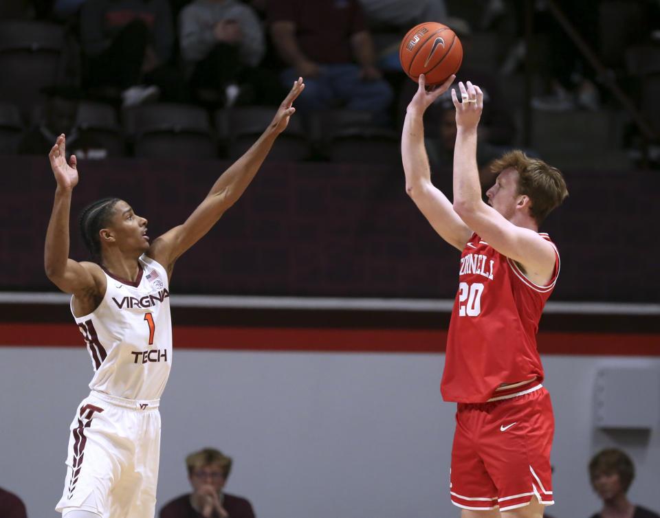 Cornell's Chris Manon, right, shoots over Virginia Tech's David N'Guessan (1) during the first half of an NCAA college basketball game Wednesday, Dec. 8 2021, in Blacksburg, Va. (Matt Gentry/The Roanoke Times via AP)