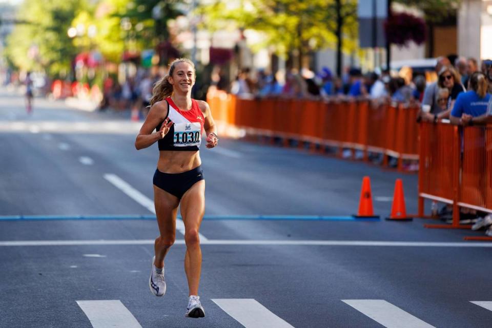 Katy Kunc crosses the line as the first female finisher of the Bluegrass 10,000. The former University of Kentucky runner has won the women’s division three times.