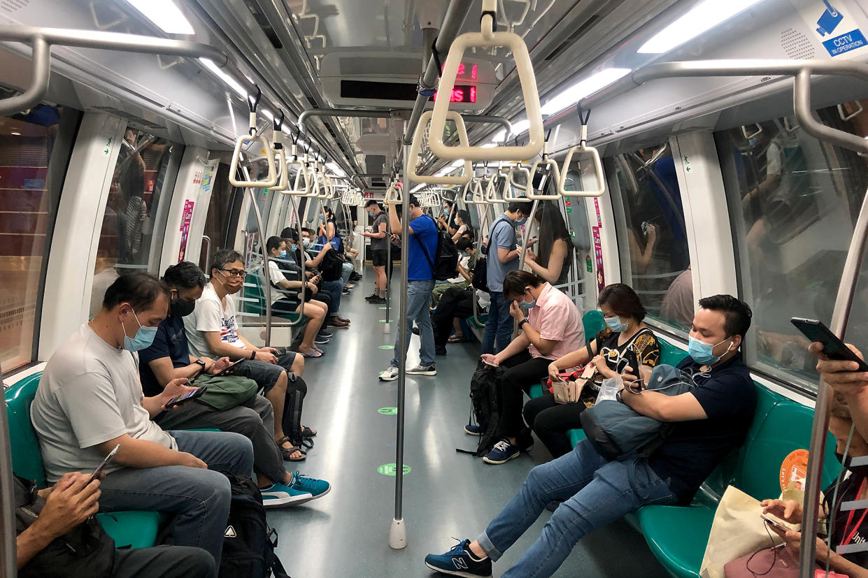 People in face masks seen on a East-West line MRT train on 12 May 2020. (PHOTO: Dhany Osman / Yahoo News Singapore)