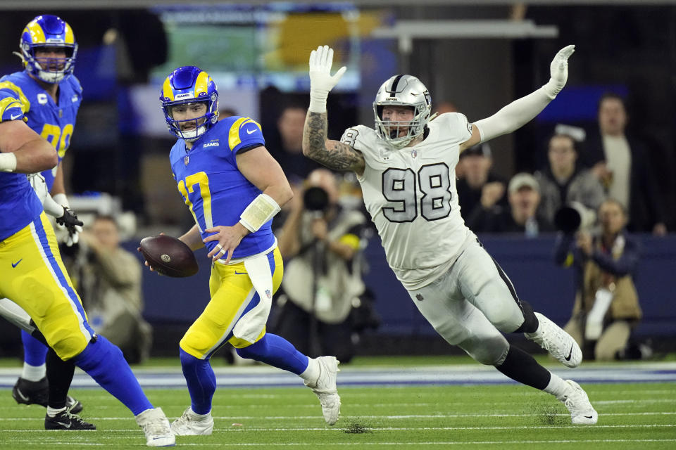 Las Vegas Raiders defensive end Maxx Crosby (98) pressures Los Angeles Rams quarterback Baker Mayfield during the second half of an NFL football game Thursday, Dec. 8, 2022, in Inglewood, Calif. (AP Photo/Mark J. Terrill)