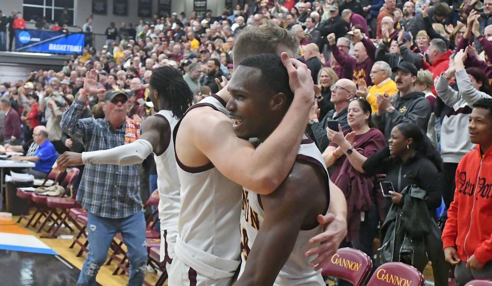 Gannon University's Zach Hobbs, left, and Nigel Haughton celebrate a last-second win over the University of Charleston.