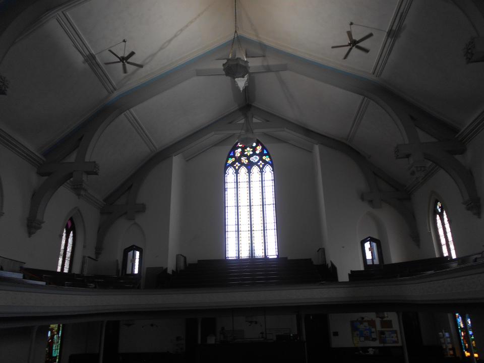 Inside of Landmark Church in Binghamton, facing rear stained glass window.