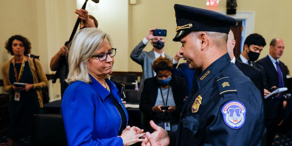 Rep. Liz Cheney, R-Wyo., speaks with U.S. Capitol Police Sgt. Aquilino Gonell after a House select committee hearing on the Jan. 6 attack on Capitol Hill in Washington, on July 27, 2021.
