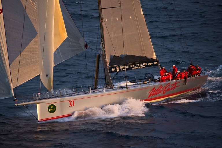 This Rolex handout photo released on December 27, 2012 shows supermaxi Wild Oats XI at sunrise during the Sydney to Hobart yacht race. Wild Oats XI was on track to beat the race record and claim a sixth line honours win as controversy raged over the expulsion of supermaxi Wild Thing