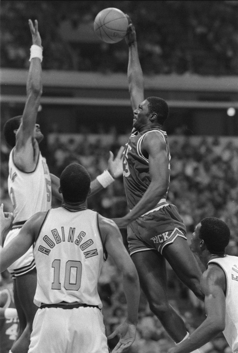 N.C. State’s Alvin Battle drives to the basket against Virginia’s Ralph Sampson. The Wolfpack won the championship 81-78.