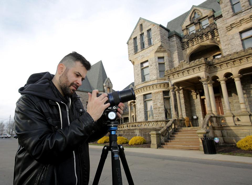 Seth Breedlove of the Massillon-based Small Town Monsters is shown filming outside the Ohio State Reformatory in Mansfield in 2021. Breedlove will be presenting the first Monster Fest convention on June 3 in downtown Canton.