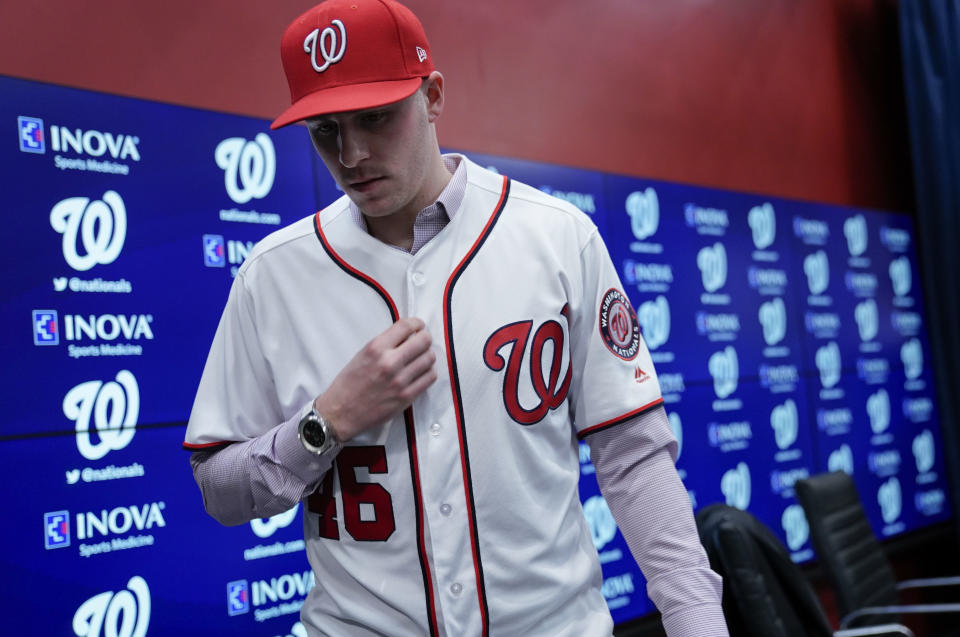 Washington Nationals new pitcher Patrick Corbin stands up during a baseball news conference at Nationals Park in Washington, Friday, Dec. 7, 2018. Corbin agreed to terms on a six-year contract and joins the Nationals after playing for the Arizona Diamondbacks. (AP Photo/Pablo Martinez Monsivais)