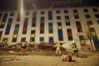 <p>Rescure workers search the damaged Marshal Hotel in Hualien, eastern Taiwan, early Feb. 7, 2018, after a strong earthquake struck the island.<br> (Photo: Paul Yang/AFP/Getty Images) </p>