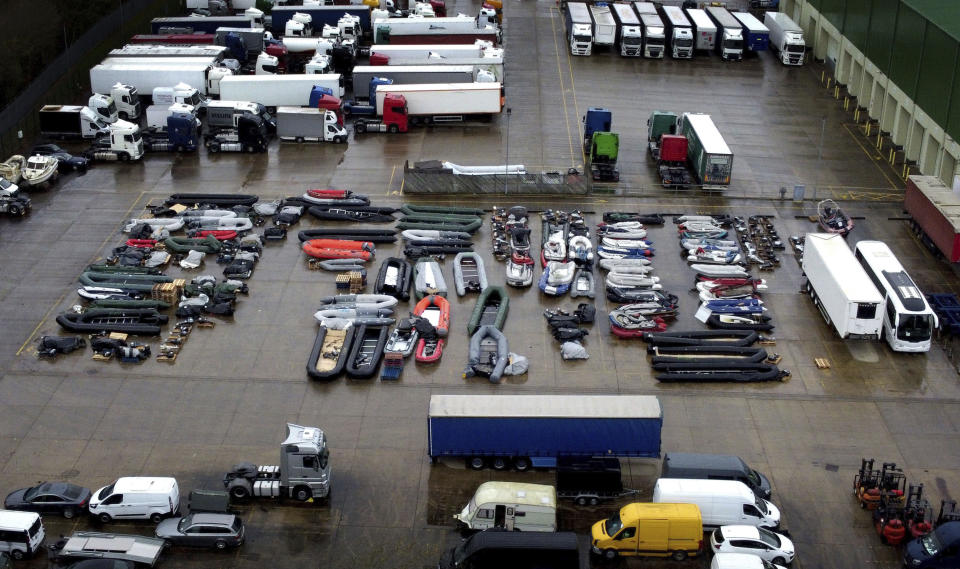 A view of boats used by people thought to be migrants to cross the Channel, stored at a storage facility near Dover in Kent, England, Friday, Nov. 26, 2021. France has reacted angrily to new British proposals for dealing with the deadly flow of migrants between their shores. A British letter and France’s response to it are the latest crossing of swords in what has become an increasingly fractious relationship between the erstwhile European partners. French President Emmanuel Macron on Friday scolded the office of British Prime Minister Boris Johnson for making public the letter that the British leader sent on Thursday. (Gareth Fuller/PA via AP)