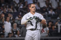 New York Yankees' Harrison Bader prepares to take the field after striking out during the second inning of the team's baseball game against the Boston Red Sox, Friday, Aug. 18, 2023, in New York. (AP Photo/Bebeto Matthews)