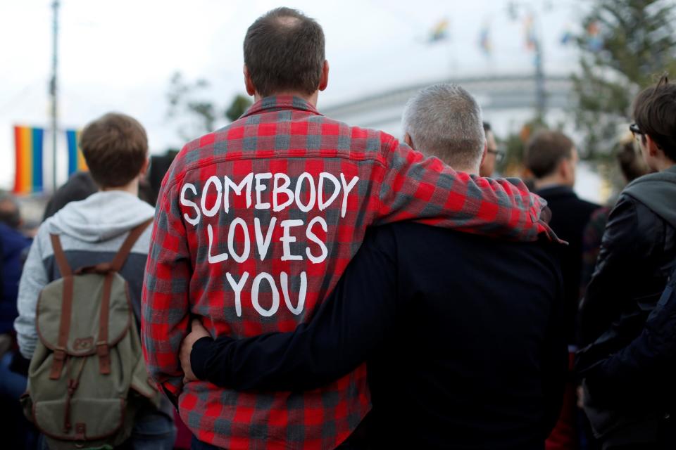 <p>People attend a San Francisco vigil for the victims of the Orlando massacre, June 12, 2016. (Stephen Lam/Reuters) </p>