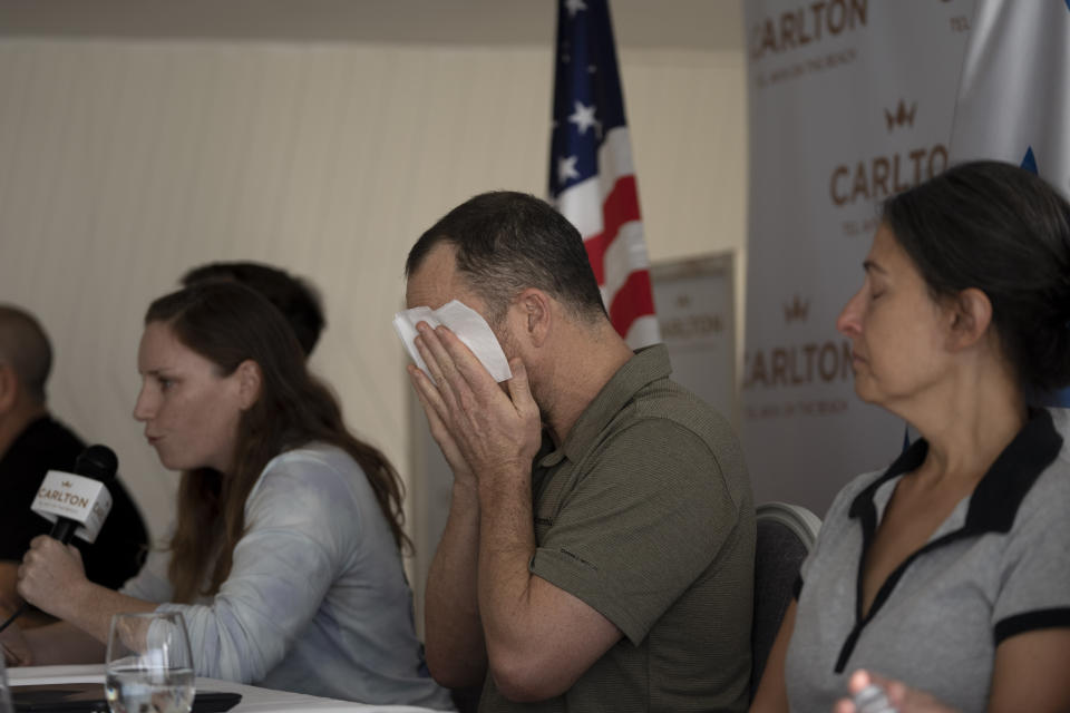 Nahal Neta, son of Adrienne Neta, 66, a nurse living in Kibbitz Be'eri missing since a Hamas surprise attack on the Gaza border, weeps during a news conference by U.S. citizens whose relatives are missing, in Tel Aviv, Israel, Tuesday, Oct. 10, 2023. (AP Photo/Maya Alleruzzo)