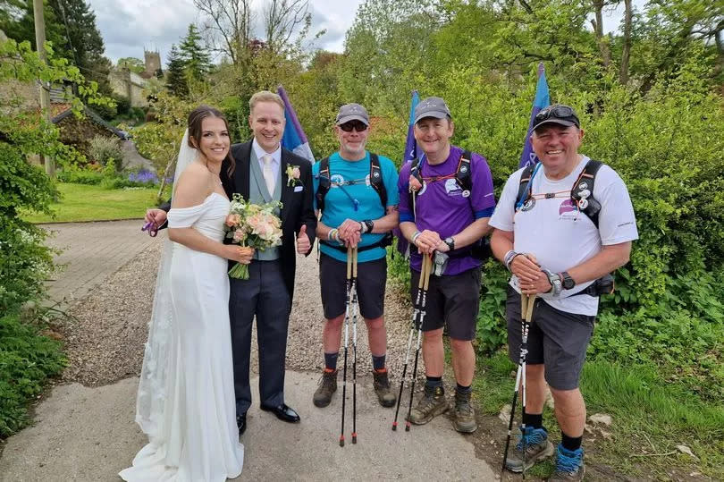 Josh and Liv were having their wedding pictures taken when the three dads happened to come across them during their walk -Credit:3 Dads Walking